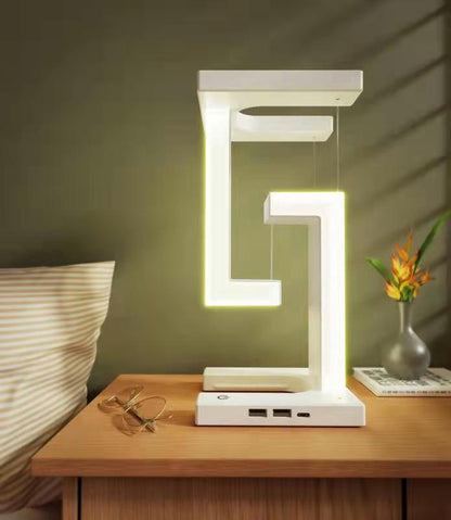 Lámpara de mesa colgante creativa con carga inalámbrica para smartphone, lámpara de equilibrio flotante para el dormitorio del hogar.