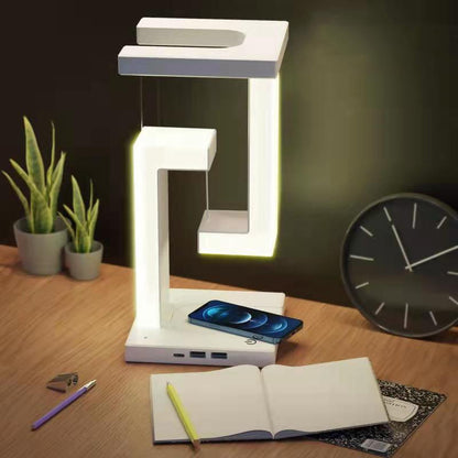 Lámpara de mesa colgante creativa con carga inalámbrica para smartphone, lámpara de equilibrio flotante para el dormitorio del hogar.